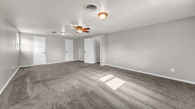 carpeted empty room with ceiling fan