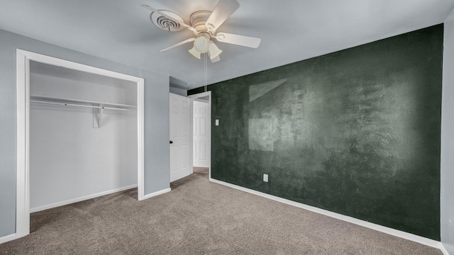 unfurnished bedroom with carpet, ceiling fan, and a closet