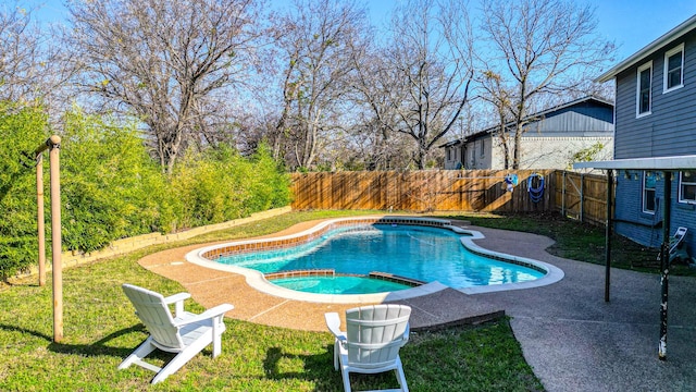 view of pool with a yard and a patio