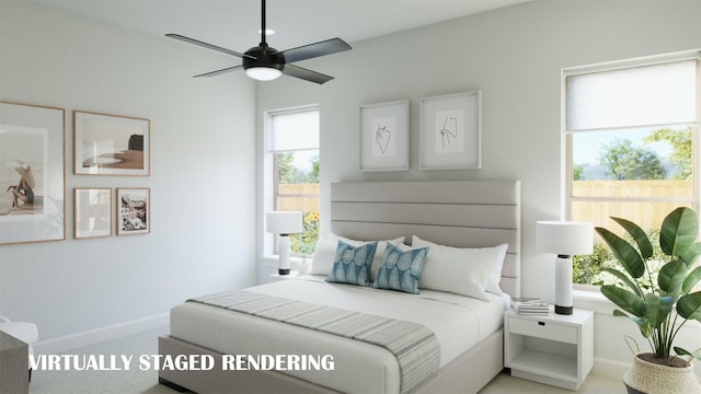 bedroom featuring carpet, ceiling fan, and multiple windows