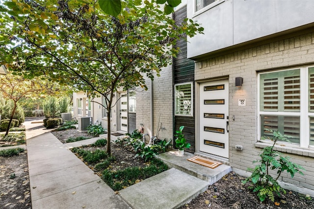 property entrance featuring central AC