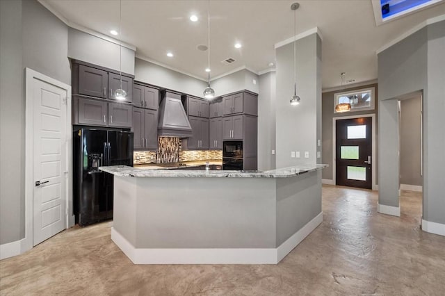 kitchen featuring black appliances, baseboards, light stone counters, and custom range hood