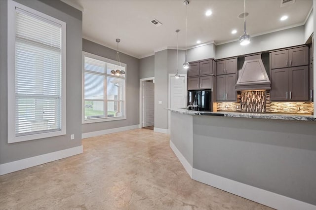 kitchen with decorative backsplash, baseboards, custom exhaust hood, and black refrigerator with ice dispenser