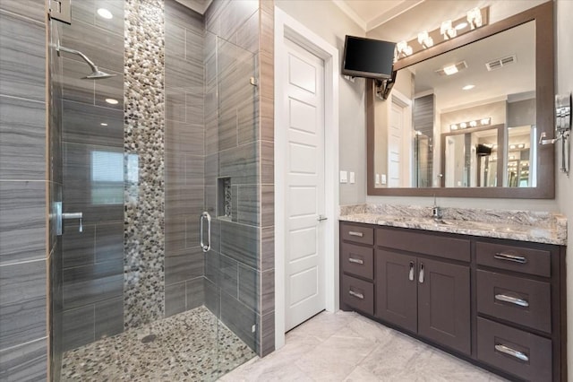 full bath with vanity, visible vents, and a stall shower