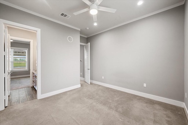 unfurnished bedroom with carpet floors, baseboards, ornamental molding, visible vents, and recessed lighting