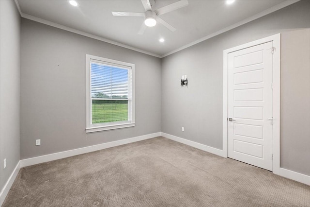carpeted spare room featuring ceiling fan, baseboards, ornamental molding, and recessed lighting