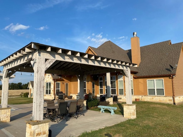 view of patio with grilling area and outdoor dining space