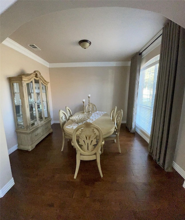 dining area featuring crown molding