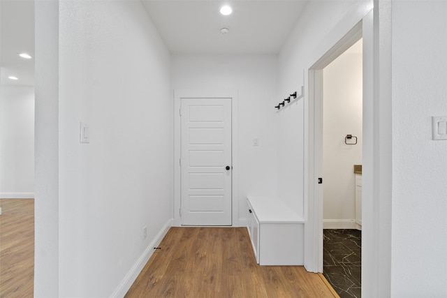 mudroom with light hardwood / wood-style flooring