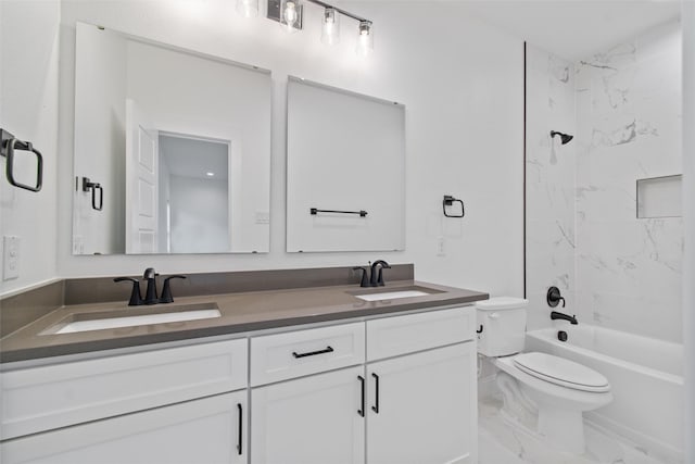 full bathroom with vanity, toilet, and tiled shower / bath