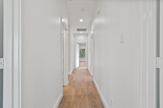 hall with light wood-type flooring