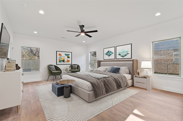 bedroom featuring ceiling fan and light hardwood / wood-style floors