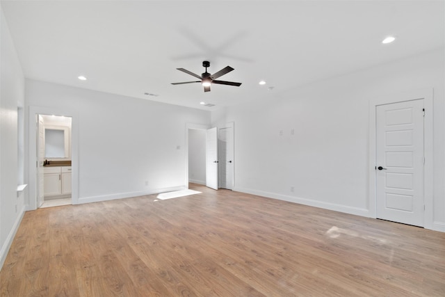 unfurnished room with ceiling fan and light wood-type flooring