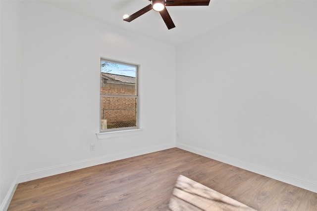 empty room with ceiling fan and wood-type flooring