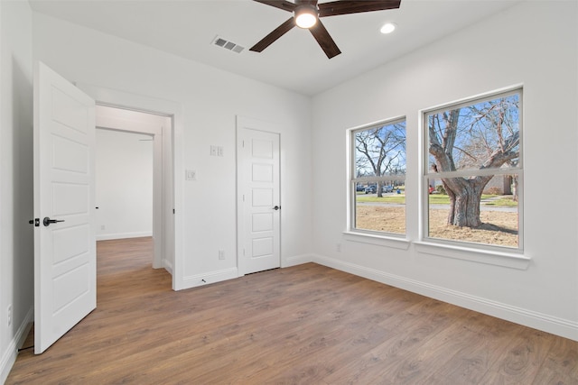 unfurnished bedroom with wood-type flooring and ceiling fan