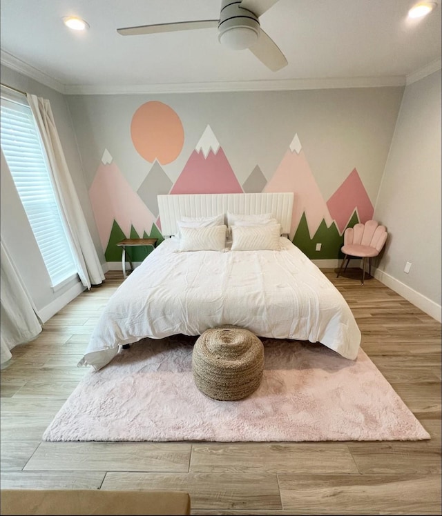 bedroom featuring ornamental molding, hardwood / wood-style floors, and ceiling fan