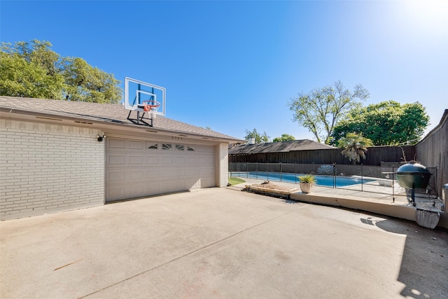 exterior space featuring a fenced in pool