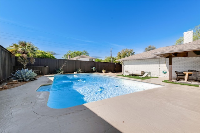 view of swimming pool featuring a patio area