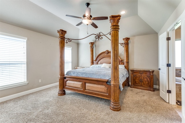 bedroom featuring carpet flooring, multiple windows, vaulted ceiling, and ceiling fan