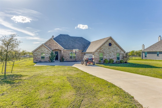 view of front of home featuring a garage and a front yard