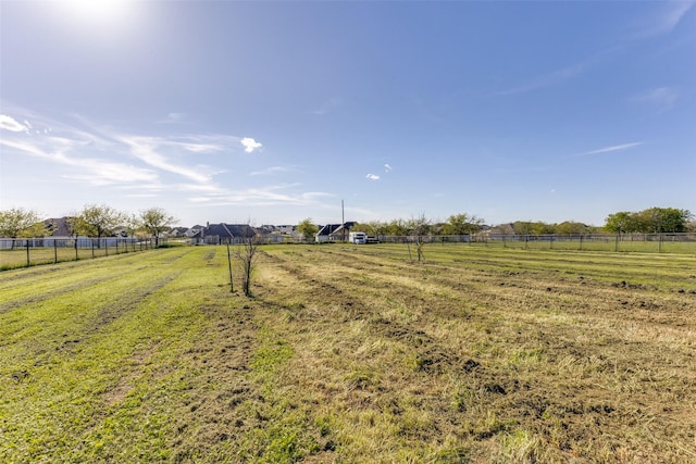 view of yard with a rural view