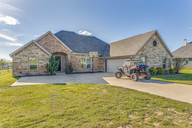 view of front of home with a front yard and a garage