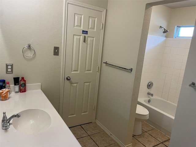 full bathroom with toilet, vanity, tiled shower / bath combo, and tile patterned floors