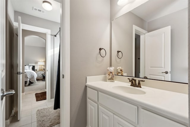 bathroom featuring tile patterned floors and vanity