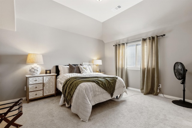 carpeted bedroom featuring vaulted ceiling