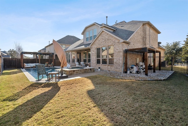 rear view of property with an outdoor living space, a jacuzzi, a patio, and a yard