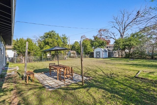 view of yard with a patio and a storage shed