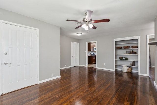 unfurnished bedroom featuring ceiling fan and dark hardwood / wood-style floors