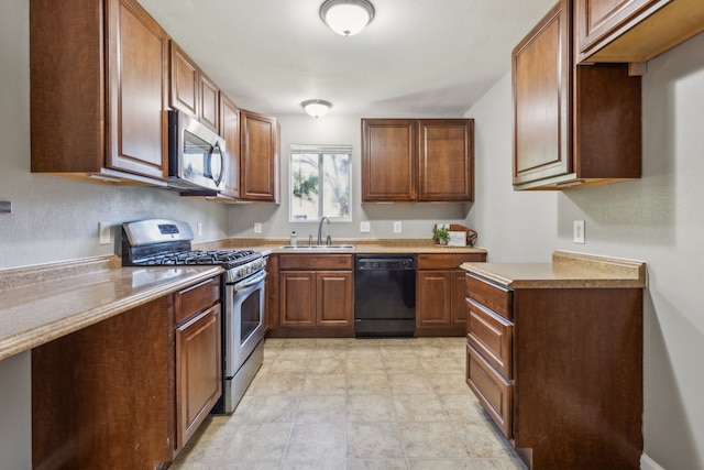 kitchen with appliances with stainless steel finishes and sink