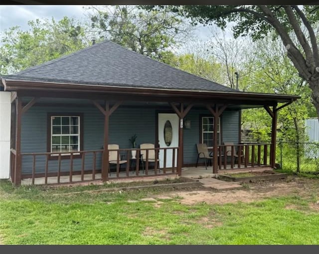 view of front of home featuring a front lawn and a porch