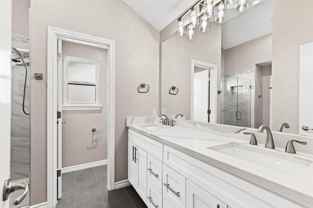 bathroom featuring tile patterned floors, lofted ceiling, an enclosed shower, a textured ceiling, and vanity