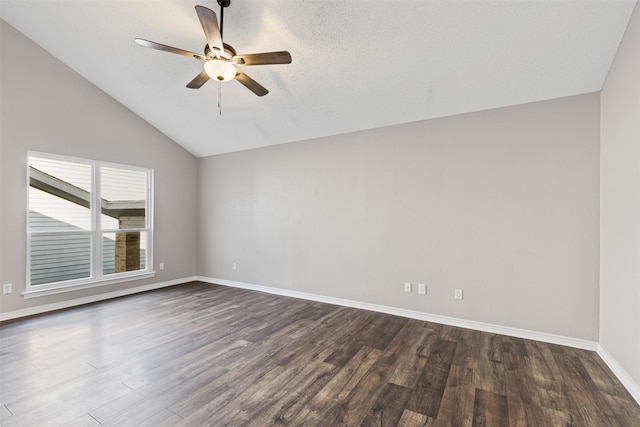 empty room featuring a textured ceiling, vaulted ceiling, ceiling fan, and dark wood-type flooring