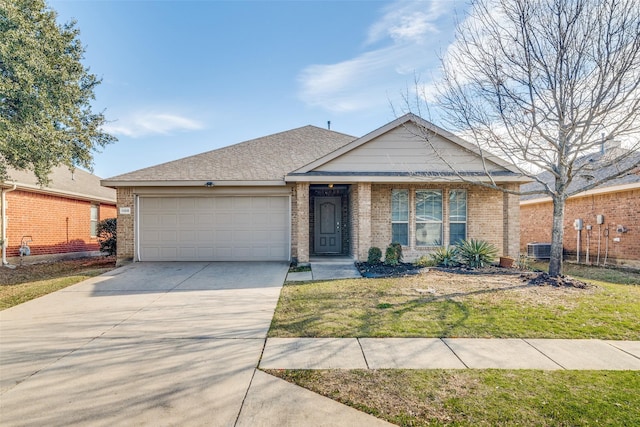 view of front of property with a front yard and a garage