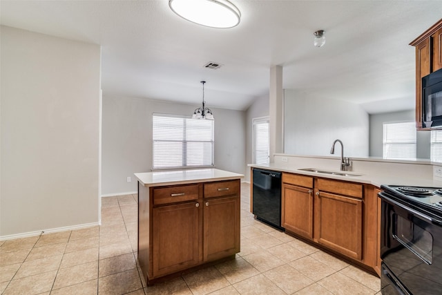 kitchen featuring sink, hanging light fixtures, a notable chandelier, a kitchen island, and black appliances