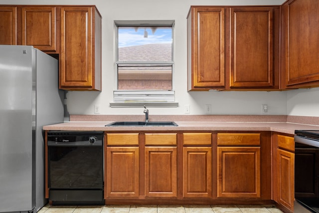 kitchen with stainless steel fridge, dishwasher, sink, and stove