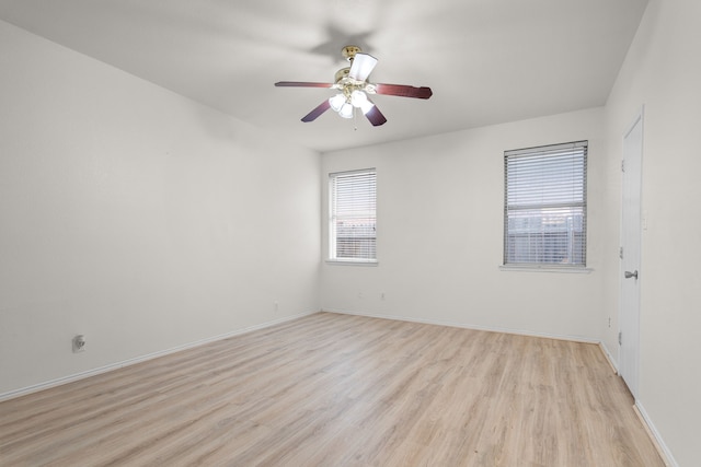 spare room featuring ceiling fan and light wood-type flooring