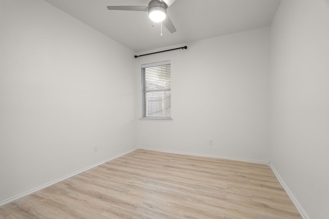 spare room with ceiling fan and light wood-type flooring