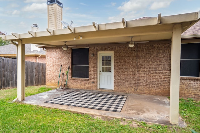 property entrance with a patio and ceiling fan