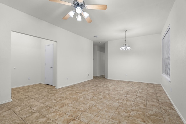 unfurnished room with ceiling fan with notable chandelier