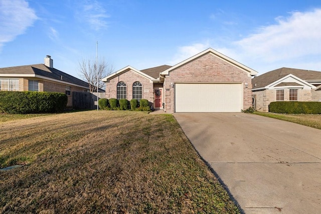 ranch-style home featuring a garage and a front lawn