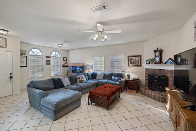 living room featuring ceiling fan and light tile patterned floors