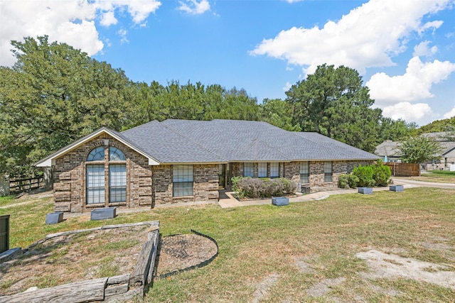 single story home with a front yard