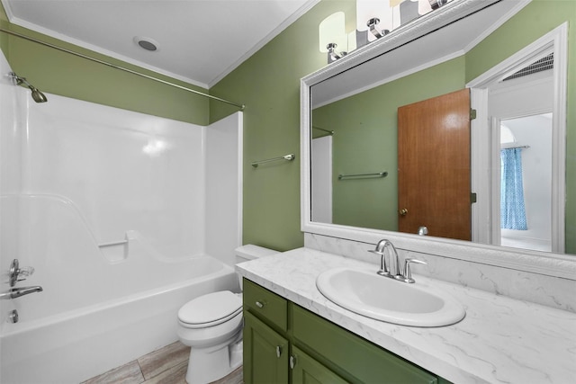 full bathroom with vanity, toilet, crown molding, and bathing tub / shower combination