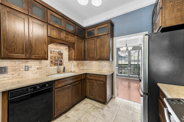 kitchen with dishwasher, sink, light stone countertops, a notable chandelier, and stainless steel refrigerator