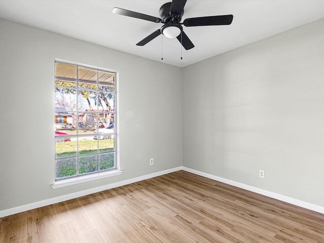 empty room featuring ceiling fan and light wood-type flooring