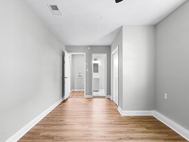 hall with light hardwood / wood-style flooring